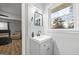 Modern bathroom with gray vanity, black matte faucet, and window at 3063 Lynn Sw Dr, Atlanta, GA 30311