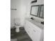 Double vanity bathroom with marble countertops at 1511 Mims Sw St, Atlanta, GA 30314