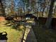 Landscaped backyard with gazebo and concrete pathway at 1004 Alford Ct, Lithonia, GA 30058