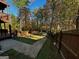 Landscaped backyard with stairs and wooden fence at 1004 Alford Ct, Lithonia, GA 30058