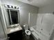 Clean bathroom with tub, toilet, and vanity at 1004 Alford Ct, Lithonia, GA 30058