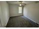Cozy bedroom with ceiling fan, window with blinds, and neutral carpeting at 1004 Alford Ct, Lithonia, GA 30058