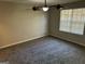 Spacious bedroom with ceiling fan and carpet at 1004 Alford Ct, Lithonia, GA 30058