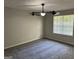 Bright bedroom with large window, ceiling fan, and neutral decor at 1004 Alford Ct, Lithonia, GA 30058