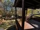 Wooden deck overlooking a fenced backyard with trees at 1004 Alford Ct, Lithonia, GA 30058