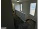 Upper level hallway with carpet and doors at 1004 Alford Ct, Lithonia, GA 30058