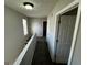 Upper level hallway with carpet and doors to bedrooms at 1004 Alford Ct, Lithonia, GA 30058