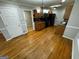 Kitchen with hardwood floors, wooden cabinets and black appliances at 1004 Alford Ct, Lithonia, GA 30058