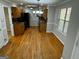 Kitchen with hardwood floors, wooden cabinets and black appliances at 1004 Alford Ct, Lithonia, GA 30058