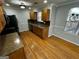 Eat-in kitchen with hardwood floors, wooden cabinets and black appliances at 1004 Alford Ct, Lithonia, GA 30058