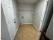 Laundry room with tile floor and shelving at 1004 Alford Ct, Lithonia, GA 30058