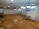 Open living room with hardwood floors and a chandelier at 1004 Alford Ct, Lithonia, GA 30058