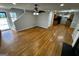 Spacious living area with hardwood floors, open concept design, and views into kitchen at 1004 Alford Ct, Lithonia, GA 30058