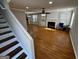 Bright living room with hardwood floors, fireplace, and access to the kitchen at 1004 Alford Ct, Lithonia, GA 30058