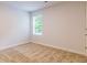Bright bedroom featuring a large window and carpeted floor at 145 Weldon St # 59, Mcdonough, GA 30253