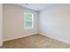Bright bedroom with neutral walls and carpet flooring at 145 Weldon St # 59, Mcdonough, GA 30253