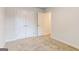 Bedroom with double doors to closet and neutral decor at 145 Weldon St # 59, Mcdonough, GA 30253