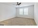 Bright bedroom with neutral carpeting and ceiling fan at 145 Weldon St # 59, Mcdonough, GA 30253