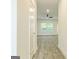 Bright hallway with wood-look floors and ceiling fan at 145 Weldon St # 59, Mcdonough, GA 30253