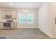 Modern kitchen with stainless steel appliances and gray cabinets at 145 Weldon St # 59, Mcdonough, GA 30253