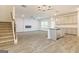 Open living room with fireplace and kitchen island at 145 Weldon St # 59, Mcdonough, GA 30253
