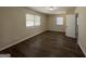 Spacious bedroom with dark brown laminate flooring and neutral walls at 2138 Springdale Rd, Atlanta, GA 30315