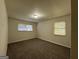 Spacious bedroom with neutral carpeting and two windows at 2138 Springdale Rd, Atlanta, GA 30315