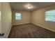 Bright bedroom with neutral carpeting and two windows at 2138 Springdale Rd, Atlanta, GA 30315
