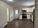 Renovated kitchen with stainless steel appliances and granite countertops at 2138 Springdale Rd, Atlanta, GA 30315