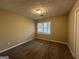 Bright bedroom featuring carpet and a window at 245 Remington Trl, Ellenwood, GA 30294