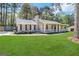 Ranch style home with a spacious lawn and carport at 245 Remington Trl, Ellenwood, GA 30294