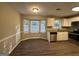 Eat in kitchen with bay window and granite countertops at 245 Remington Trl, Ellenwood, GA 30294