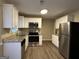 Galley style kitchen with stainless steel appliances at 245 Remington Trl, Ellenwood, GA 30294