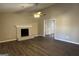 Bright living room featuring a fireplace and hardwood floors at 245 Remington Trl, Ellenwood, GA 30294