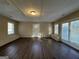 Sunroom with dark wood flooring and multiple windows at 245 Remington Trl, Ellenwood, GA 30294