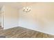 Elegant dining room featuring wood-look floors and a modern chandelier at 207 Fern Dale Drive Dr # 122, Fairburn, GA 30213