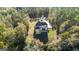 Aerial view of house showcasing large lot and wooded setting at 2202 Escalade Ct, Conyers, GA 30094