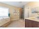 Elegant bathroom with soaking tub, shower, and double vanity at 2202 Escalade Ct, Conyers, GA 30094