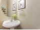 Simple and clean bathroom with pedestal sink and mirror at 2202 Escalade Ct, Conyers, GA 30094