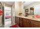 Double vanity bathroom with access to a bedroom at 2202 Escalade Ct, Conyers, GA 30094