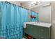 Basement bathroom with teal vanity and shower at 2202 Escalade Ct, Conyers, GA 30094
