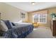 Bright bedroom with a comfortable bed and window seating at 2202 Escalade Ct, Conyers, GA 30094