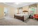 Spacious bedroom with a large bed and access to a bathroom at 2202 Escalade Ct, Conyers, GA 30094