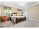 Bright bedroom with a queen-size bed and carpeted floor at 2202 Escalade Ct, Conyers, GA 30094