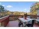 Relaxing deck with table and chairs, offering wooded views at 2202 Escalade Ct, Conyers, GA 30094