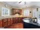 Spacious kitchen featuring granite countertops and dark wood cabinetry at 2202 Escalade Ct, Conyers, GA 30094