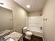Bathroom with shower/tub combo, granite vanity, and toilet at 6235 Creekford Ln, Lithonia, GA 30058
