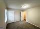 Bright bedroom with double door closet and neutral carpeting at 6235 Creekford Ln, Lithonia, GA 30058