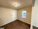Small dining area or office with hardwood floors and a window at 6235 Creekford Ln, Lithonia, GA 30058