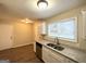 Kitchen with granite countertops, white cabinets, and stainless steel sink at 6235 Creekford Ln, Lithonia, GA 30058